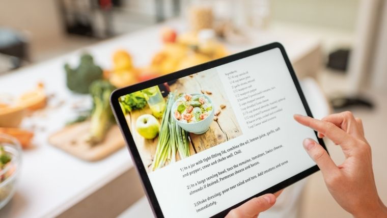 Recipe on an iPad with food in the background